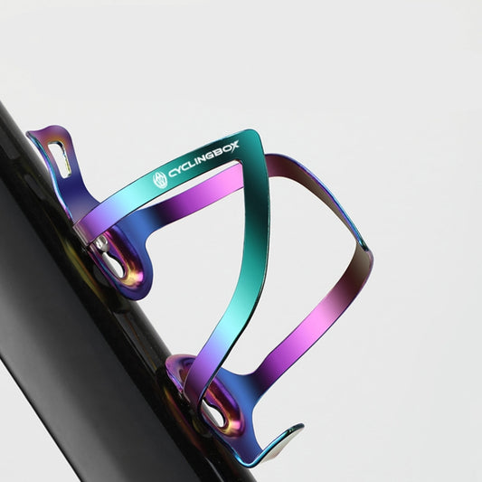 Bicycle bottle cage with iridescent rainbow finish, mounted to bike frame