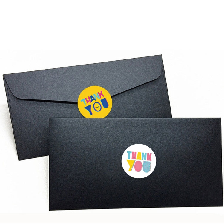 Black envelopes with small circular Thank You stickers featuring colorful text