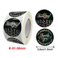 Round 'Thank you' stickers with floral wreath ring, black base on adhesive roll