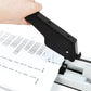 Manual stapler with black lever pressed over papers, staple feed area visible