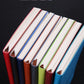 Set of A5 PU notebooks with colored covers and stitched spine edges