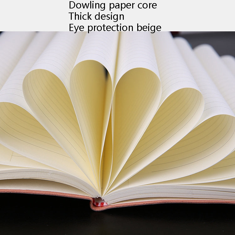 Open A5 notebook showing thick paper pages fanned out from the binding