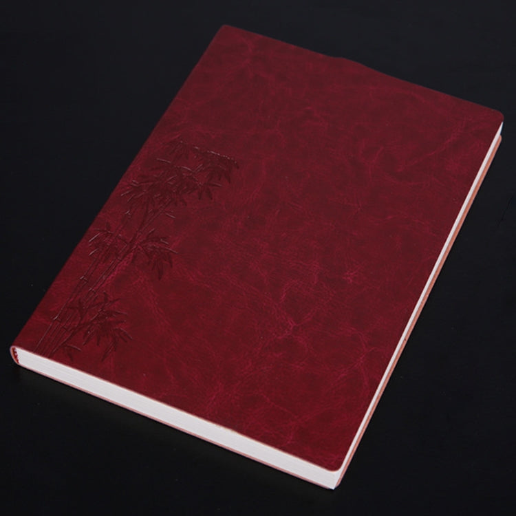 Burgundy PU notebook with embossed floral design, white page edges