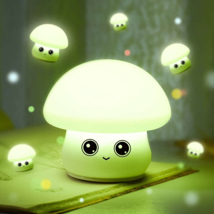Green glowing silicone mushroom night light with happy face