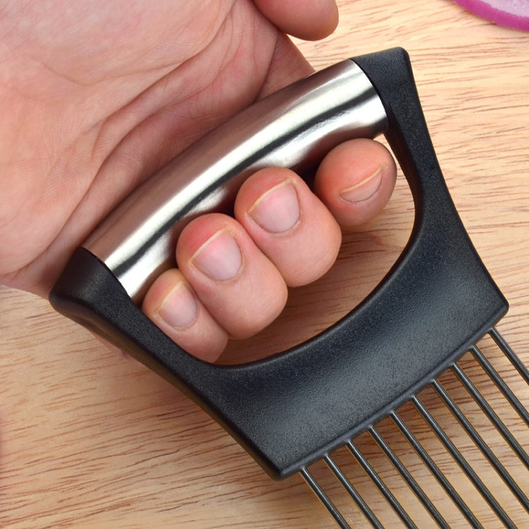 Hand holding black onion slicer fork frame with stainless steel cutting pins