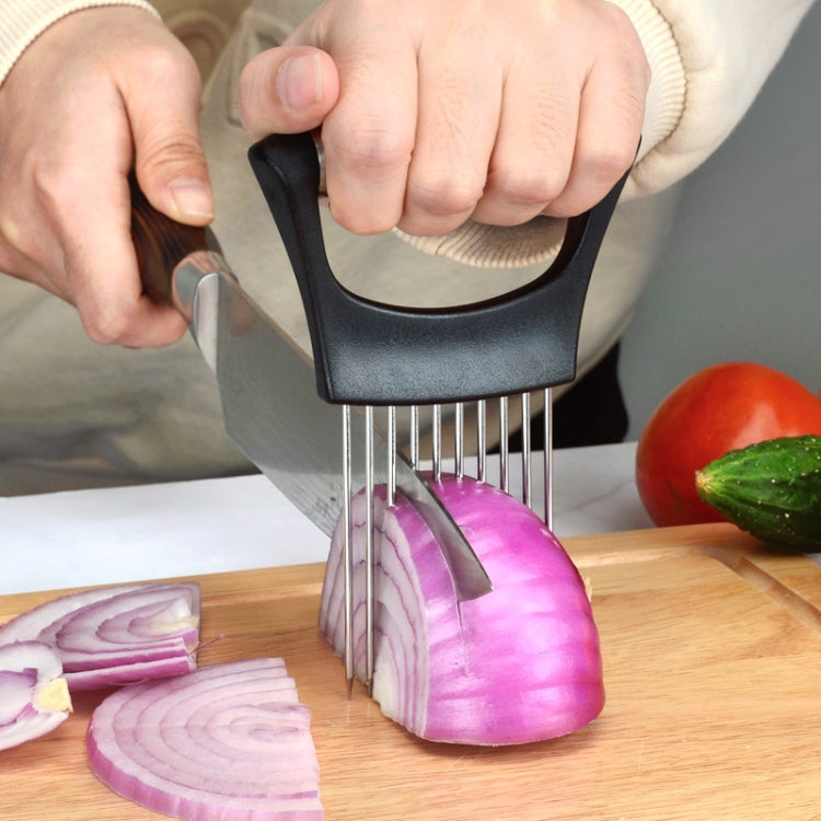 Kitchen onion slicing fork with black holder and stainless steel pins on wooden board