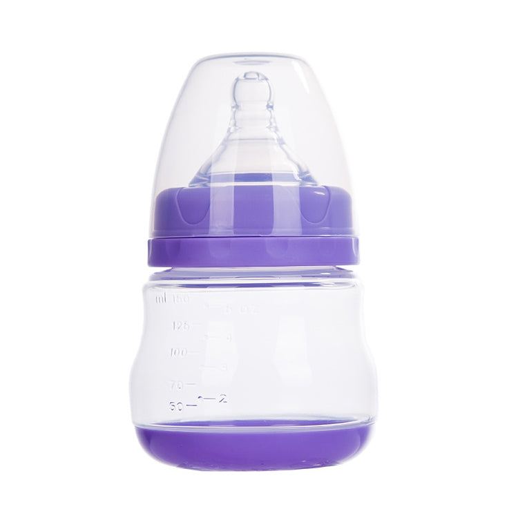 Manual breast pump with purple-tinted top and translucent bottle, hand-operated