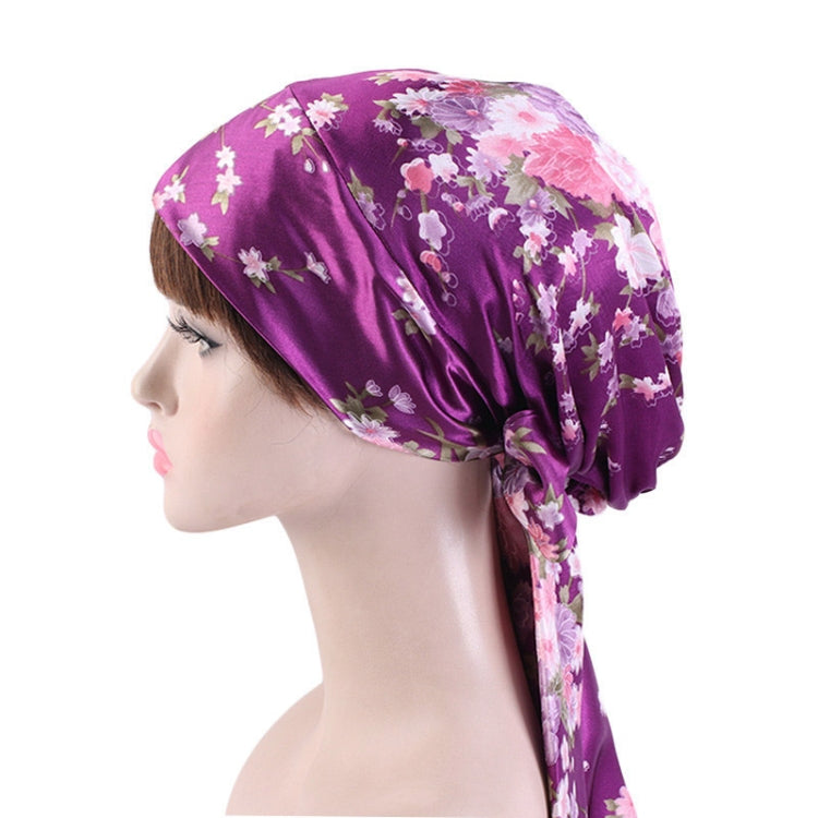 Purple floral satin turban hat with side ribbon tie and gathered crown
