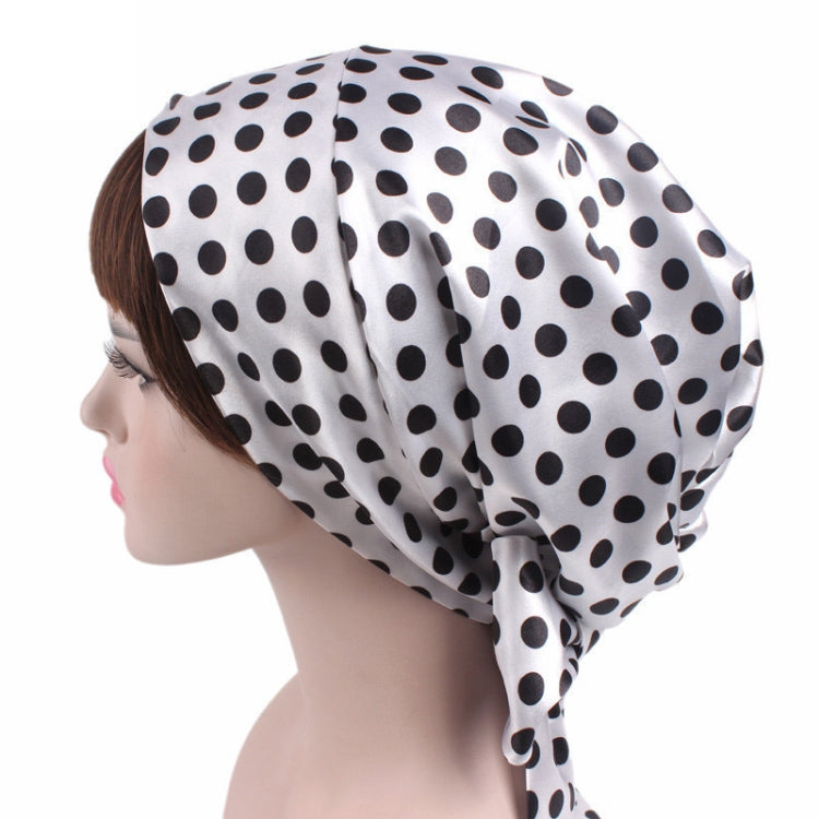 White satin turban hat with black polka dots and side drape tie