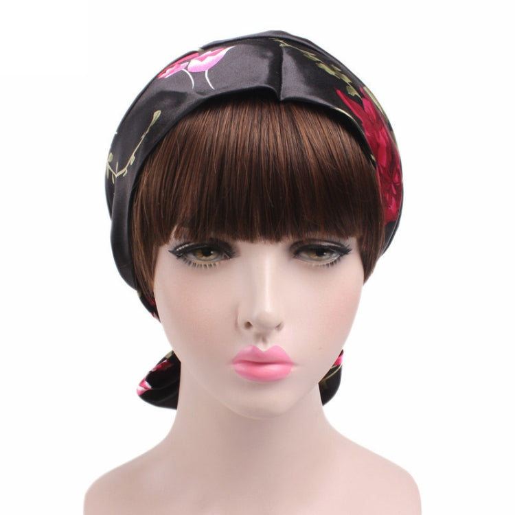 Satin ribbon bow turban hat in black with pink-red floral print, front bow