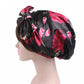 Satin print ribbon bow turban hat in black with pink tulip pattern, side bow