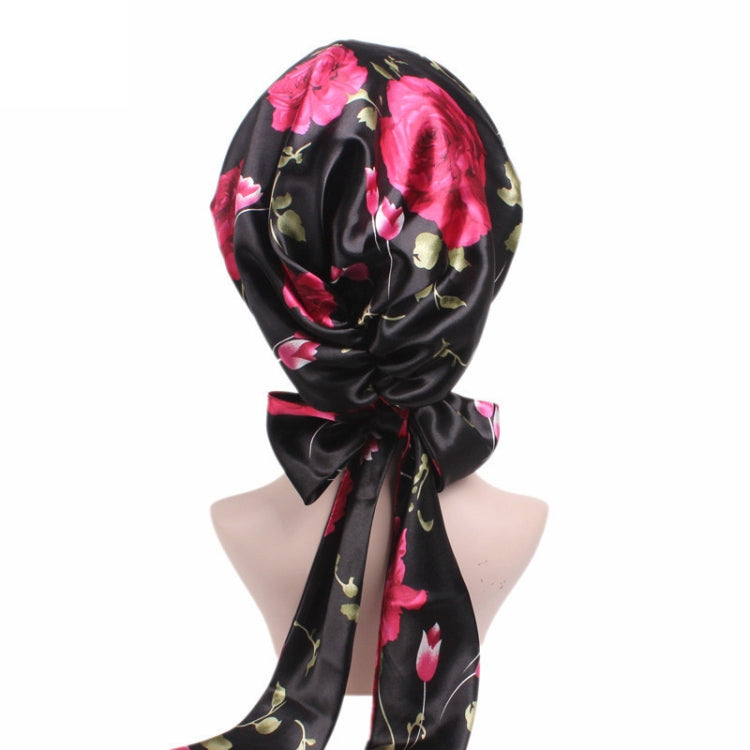 Satin turban night cap with black base, pink flower print, long ribbon tail