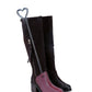 Black tall boots with zipper, fitted with a pink boot shoe expander