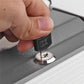 Close-up of key lock on gray dictionary book safe base