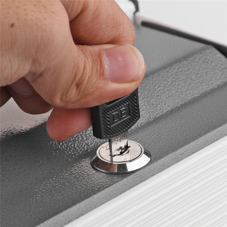 Close-up of key lock on gray dictionary book safe base