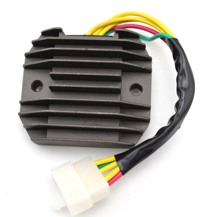 Motorcycle voltage rectifier/regulator with black finned housing and multi-wire connector