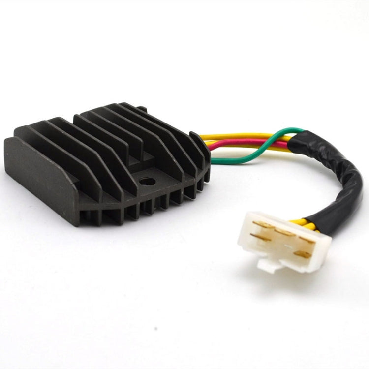 Motorcycle rectifier with black fins and three-pin white connector on wire pigtail