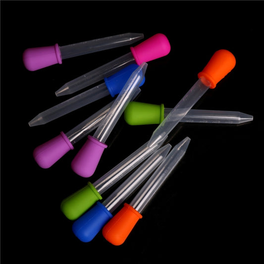 Clear plastic liquid pipette droppers with green, purple, blue, and orange silicone caps