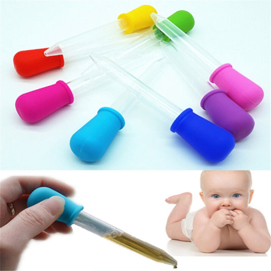 3-pack clear plastic medicine pipette droppers with colorful silicone caps, one filled