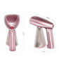 Rose-pink mini handheld garment steamer with textured nozzle top and control button