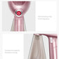 Rose-pink mini garment steamer showing power button and clear water tank window