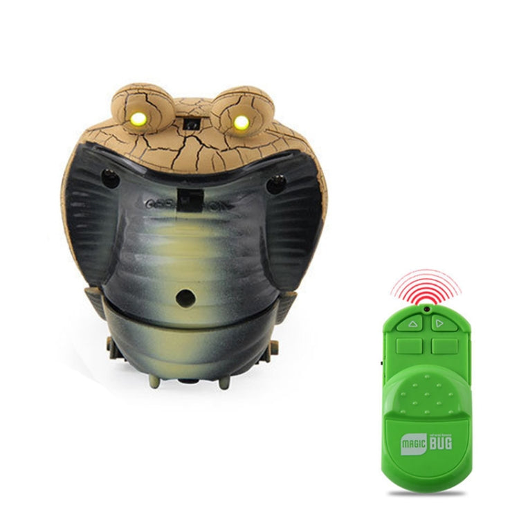 Gray cobra remote-control toy with glowing eyes and green infrared remote control.