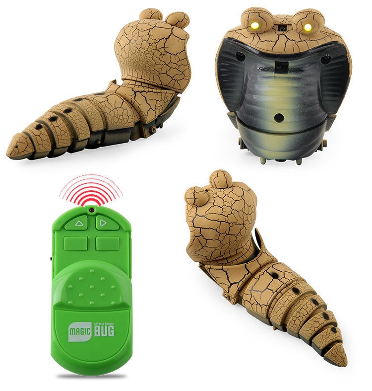 Gray cobra remote-control toy with glowing eyes plus green infrared remote controller.