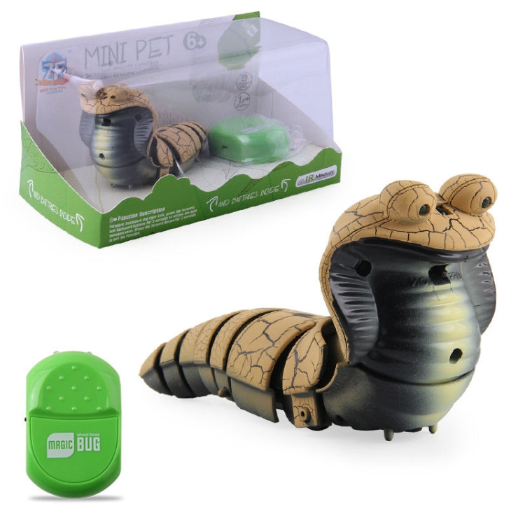 Gray cobra remote-control toy with segmented legs and green infrared remote in box.