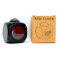 Black LED projection alarm clock beside retail packaging box