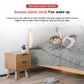 Cloud-themed smart alarm clock near a bed, compact design with cloud-shaped lights