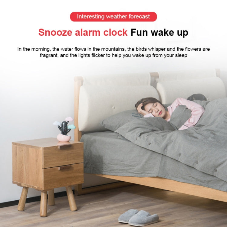 Cloud-themed smart alarm clock near a bed, compact design with cloud-shaped lights