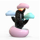 Child wake-up alarm clock with cloud weather light, glowing clouds, digital display on pink base