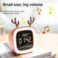 Orange deer-shaped LED alarm clock with glowing ring and time display on desk