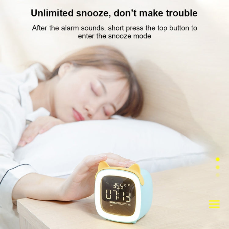 Light blue deer-shaped LED alarm clock on a nightstand with glowing time display