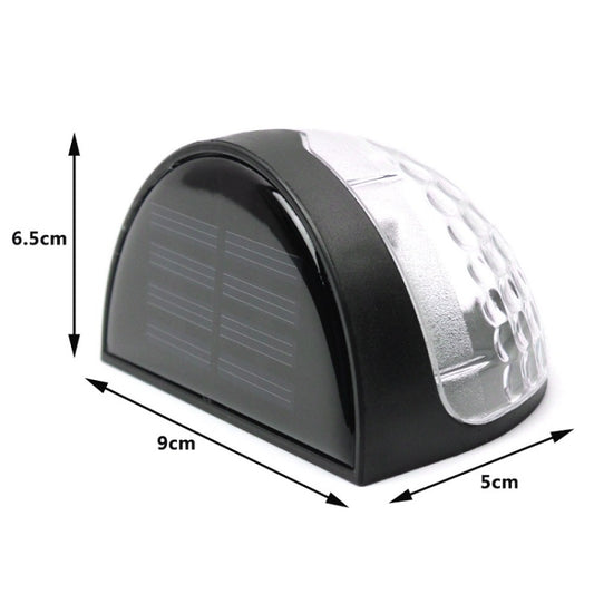 Semicircular solar LED wall light with black and silver housing and clear lens
