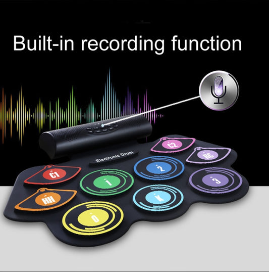 Portable electronic drum set with dark speaker bar and colored touch pad layout