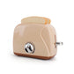 Toy egg steamer with beige base, clear lid, and rotary knob