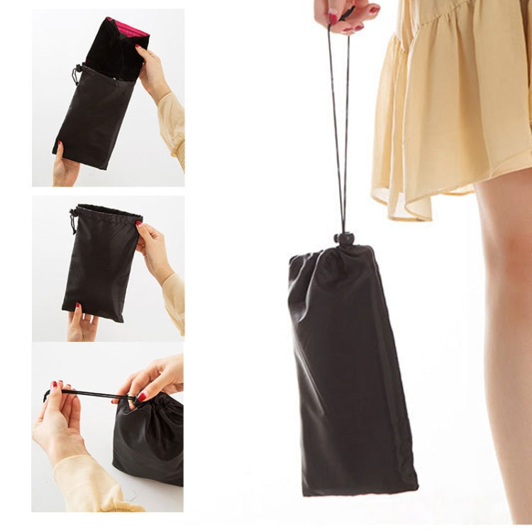 Black drawstring pouch with folded foot rest hammock for easy travel storage