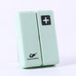 Mint green folding pill box with plus symbol, compact two-panel sealed case