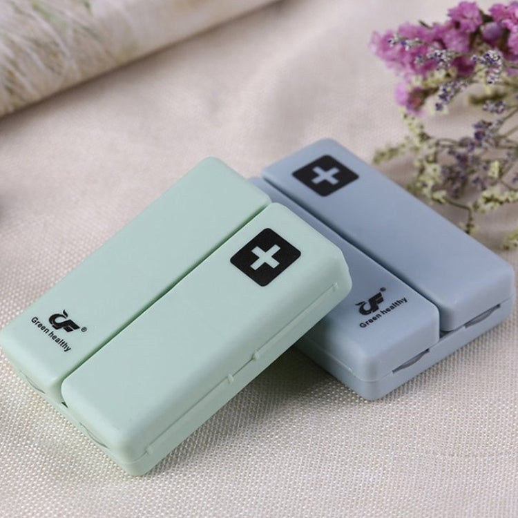Folding sealed pill box with cross-mark compartments, mint and dark blue