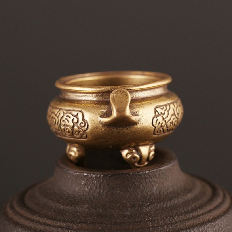Antique brass censer furnace, front view with decorative panels and pedestal base.