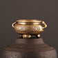 Antique brass censer furnace on pedestal base, top rim with loop handles and engraved body.