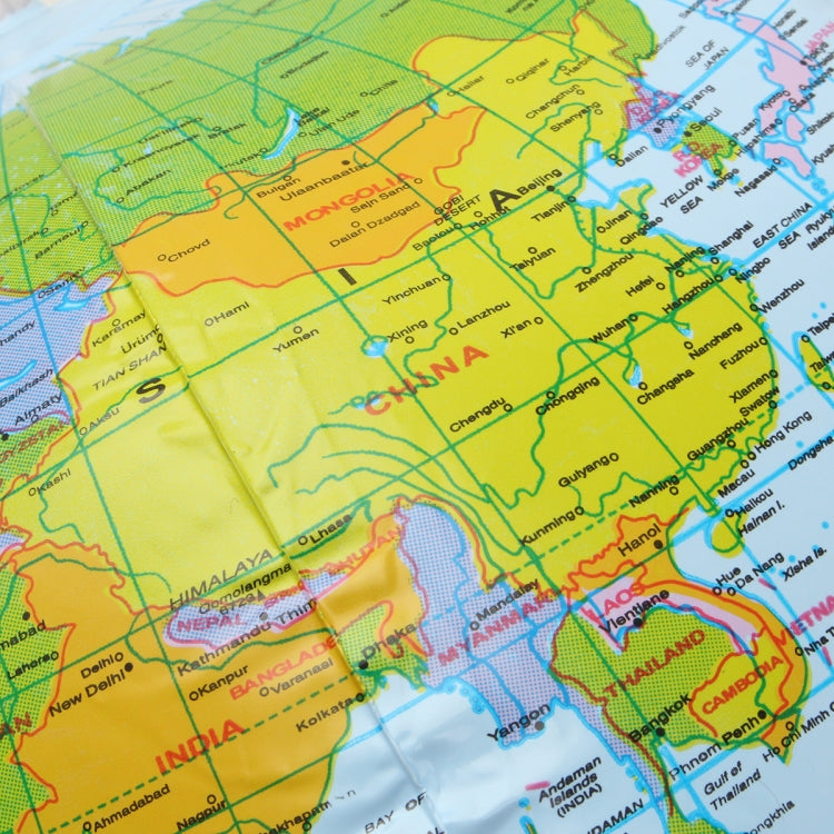 Inflatable globe map ball close-up of India and nearby regions on printed map