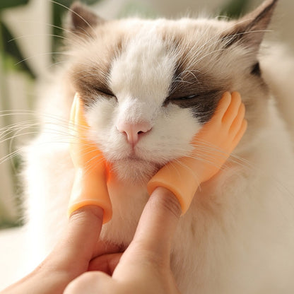 Orange silicone pet massage finger cots, petting a white cat’s face with two fingers