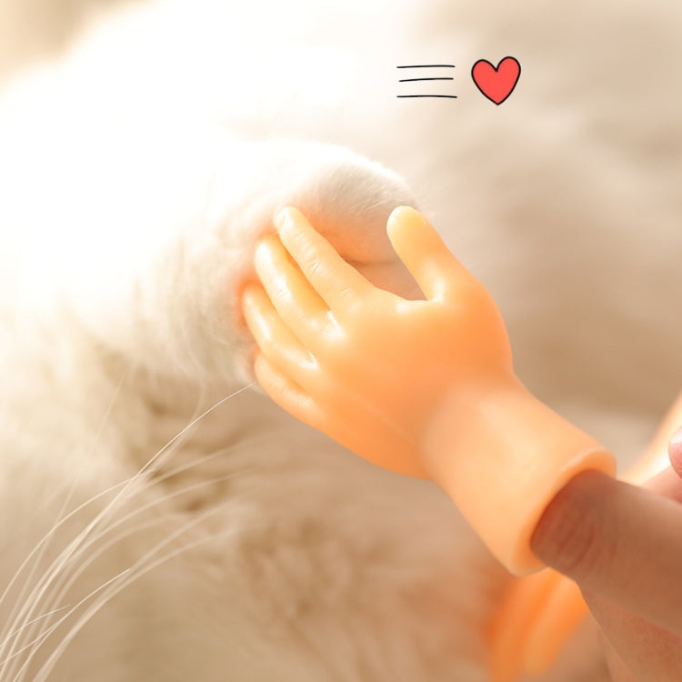 Orange silicone finger cot massage glove hand resting on a cat