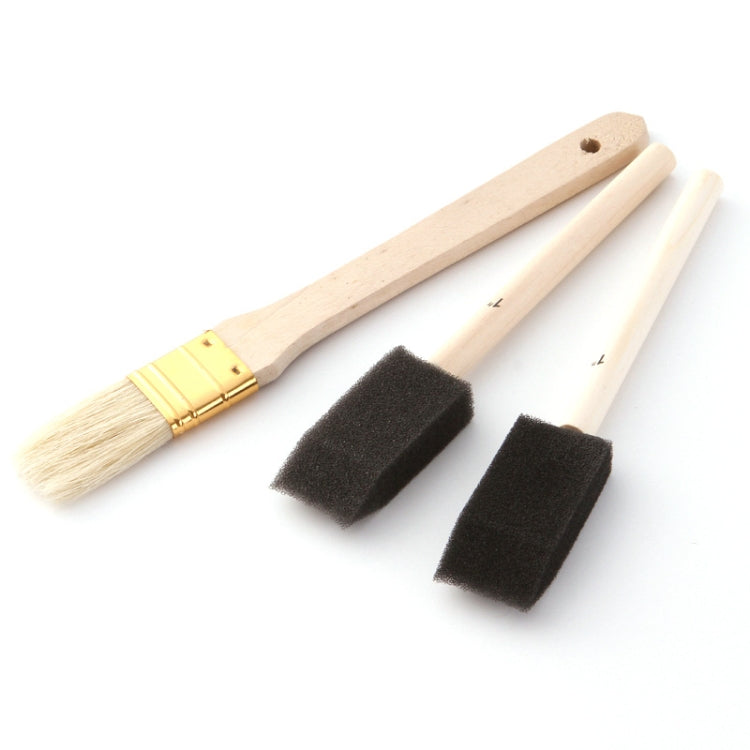 Wood-handled paint brushes with flat bristles and black foam brushes