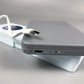 Gray calculator writing board side view with DC5V port and attached stylus