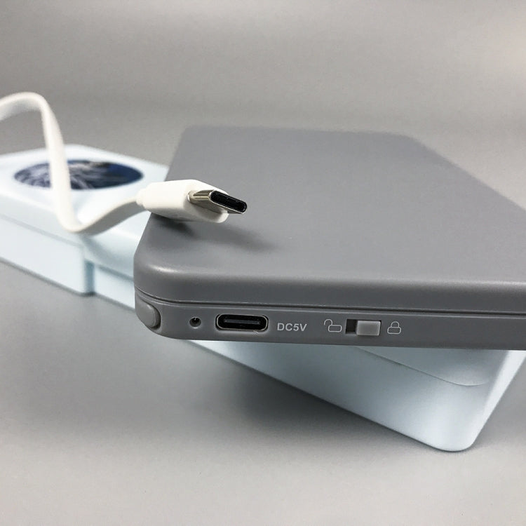 Gray calculator writing board side view with DC5V port and attached stylus