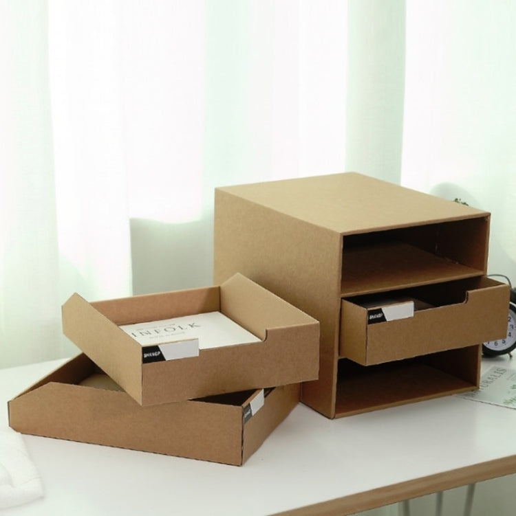 Cardboard storage cabinet with open drawers, holding A4-sized files on a desk