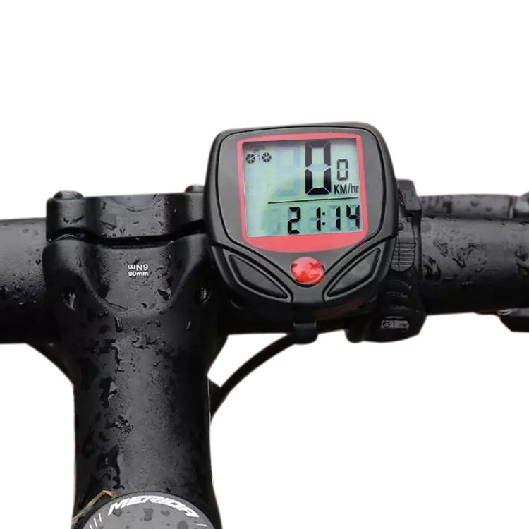 Bicycle digital speedometer with red-backlit LCD on black handlebar mount